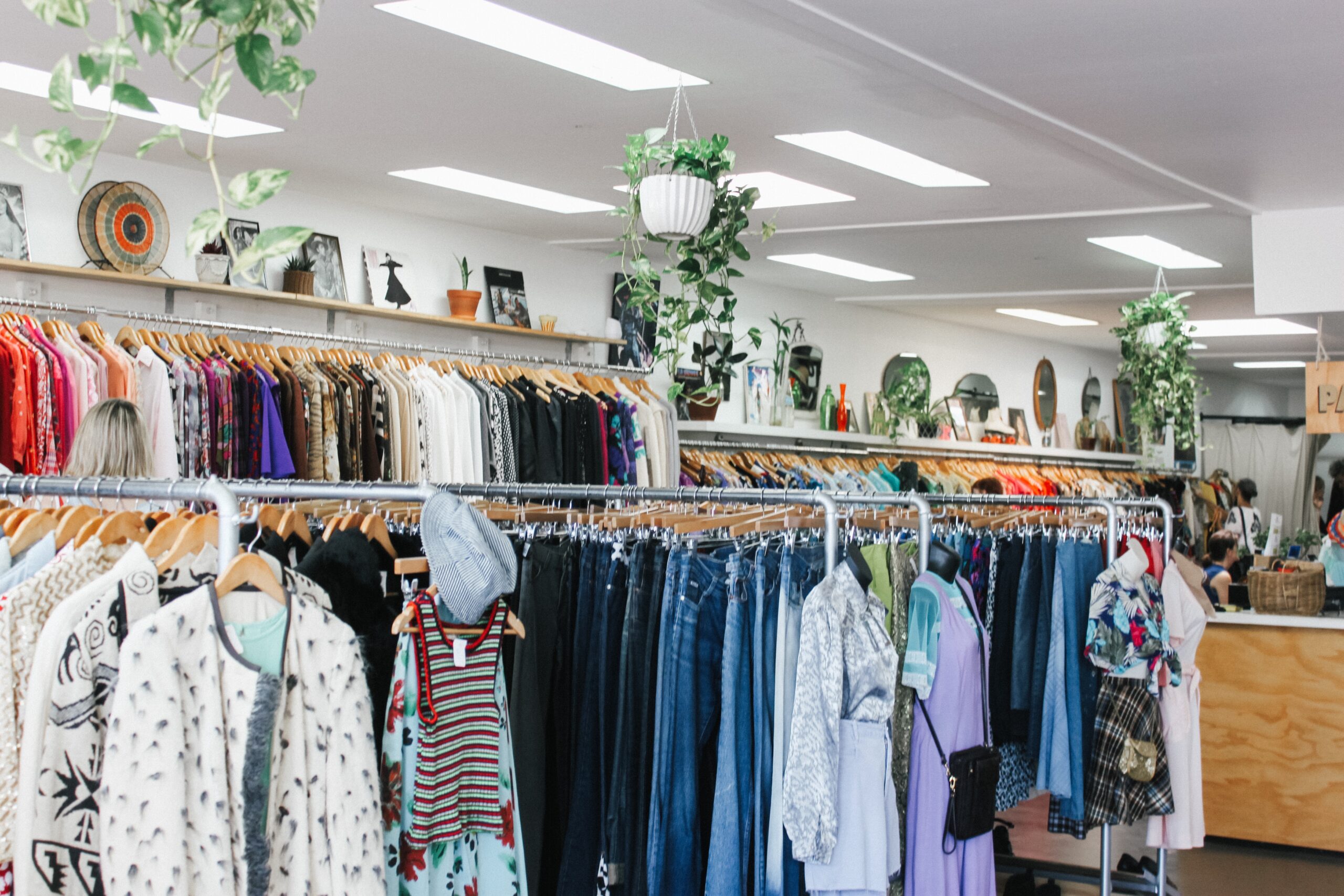 Best Charity Shops in Brighton - Clothes rail in charity shop in Brighton